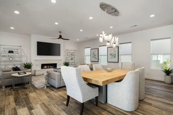 a living room with fireplace furniture and a flat screen tv