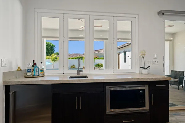 a kitchen with a sink and a window