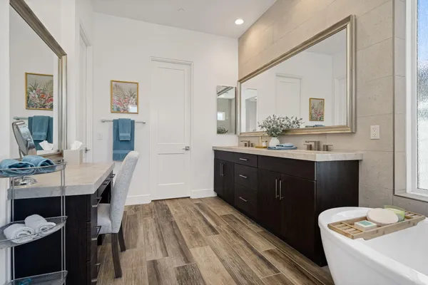 a bathroom with a tub and a sink