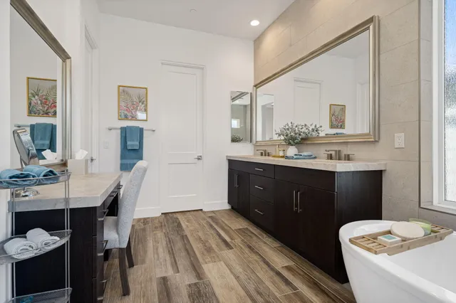 a bathroom with a tub and a sink