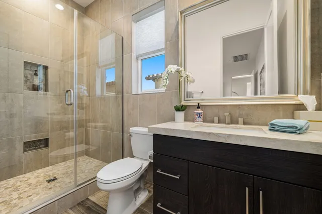 a utility room with cabinets washer and dryer