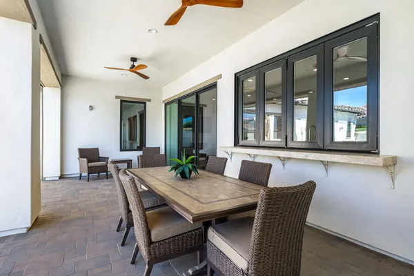 a front view of a house with a garden and a yard