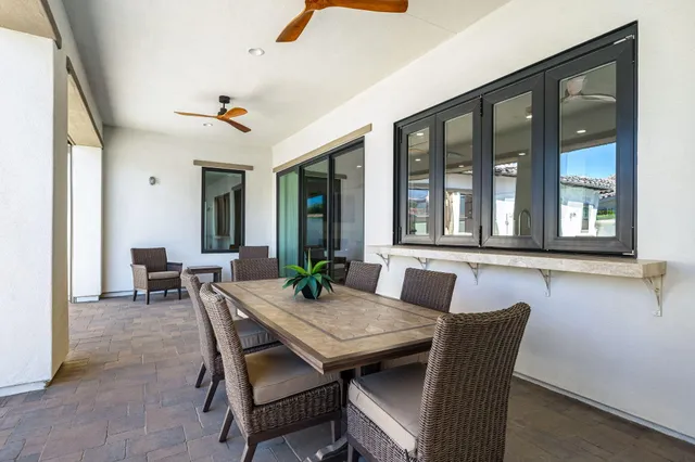 a front view of a house with a garden and a yard