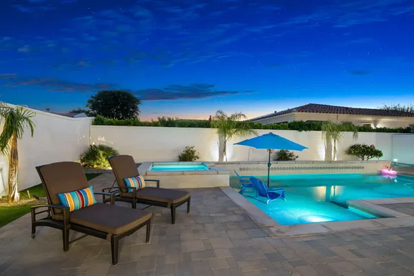 a view of pool table and chairs in patio