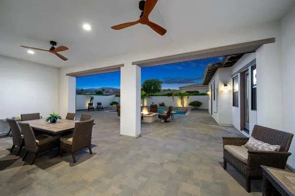 a dining room with furniture and window