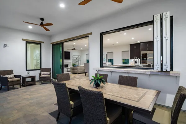 a view of a terrace with couches and potted plants