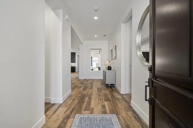 a view of a livingroom from a hallway
