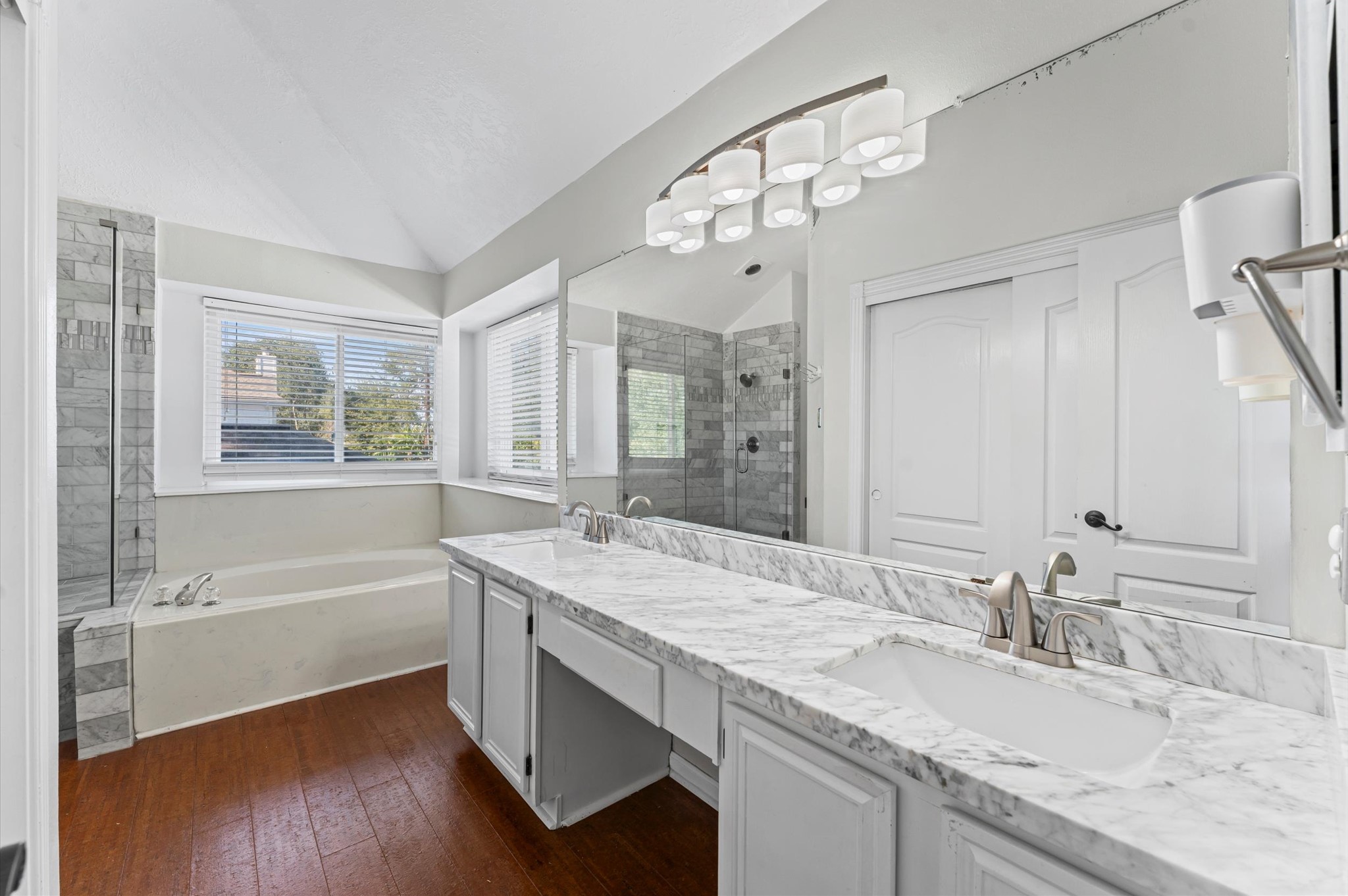 16506 Crossfield Drive Houston, TX 77095 - Photo 14 of 20 a bathroom with a granite countertop sink a large mirror and a bathtub