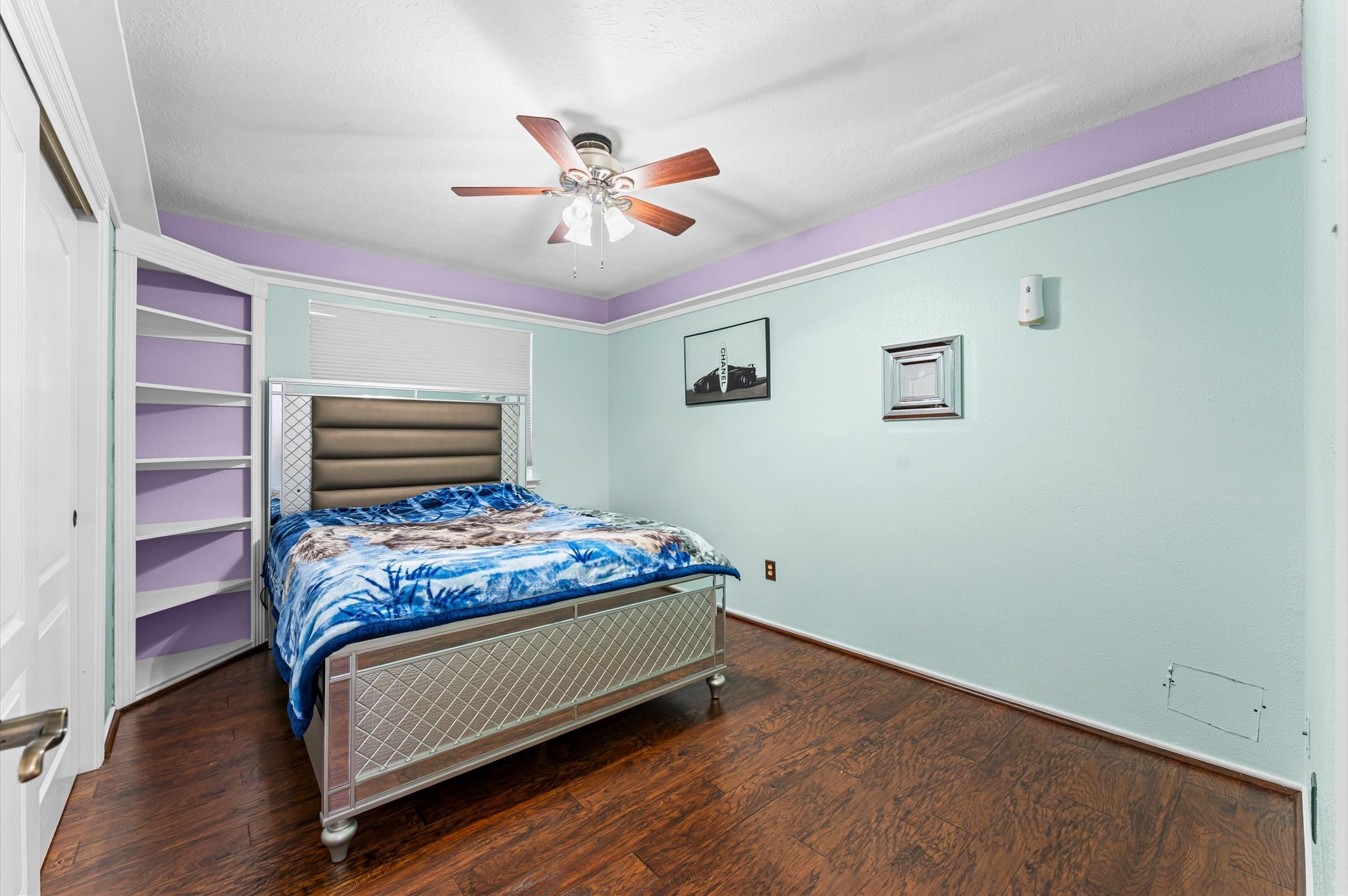 16506 Crossfield Drive Houston, TX 77095 - Photo 17 of 20 a bedroom with a bed and a chandelier