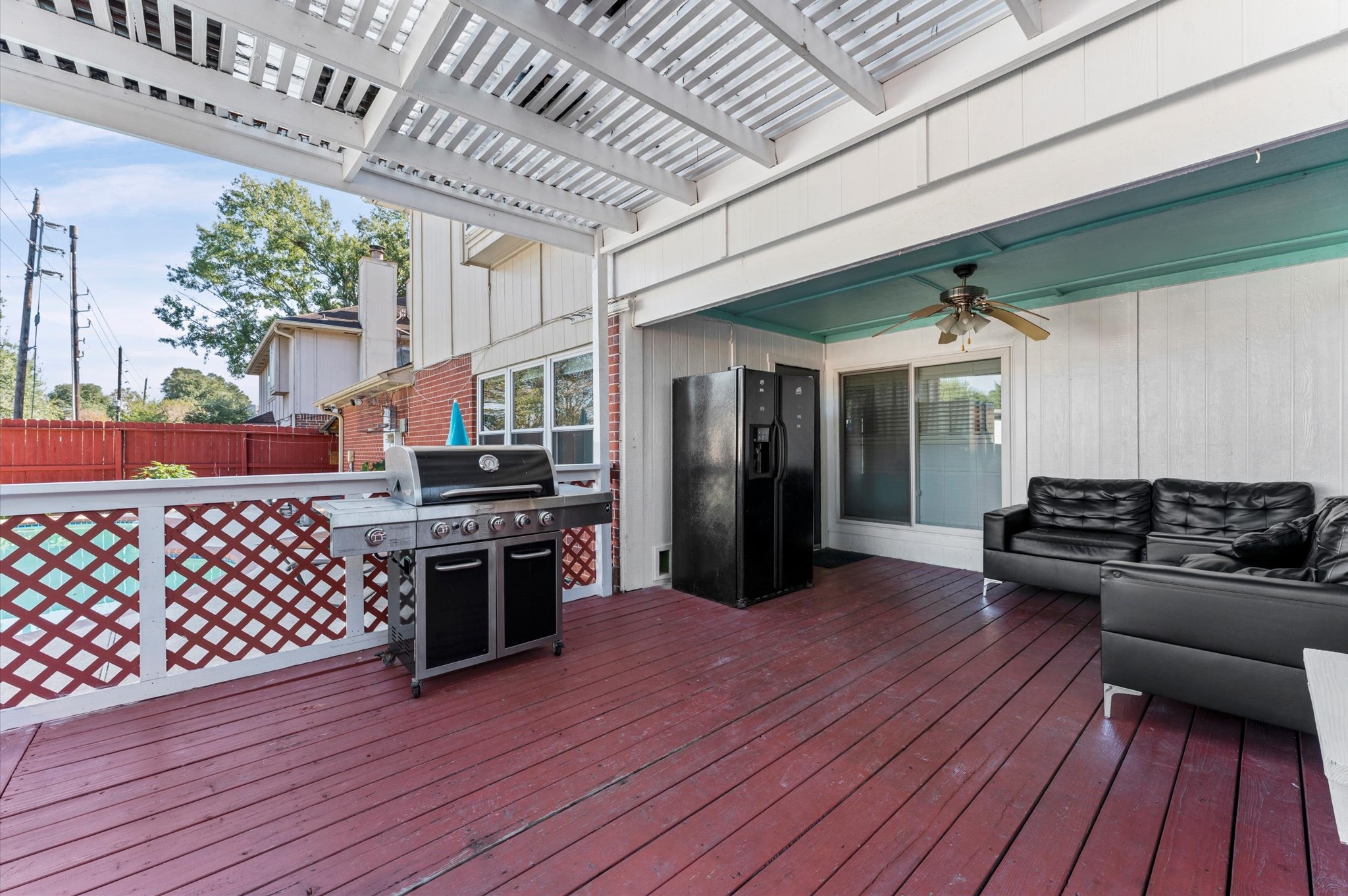 16506 Crossfield Drive Houston, TX 77095 - Photo 18 of 20 a kitchen with wooden floors and black appliances