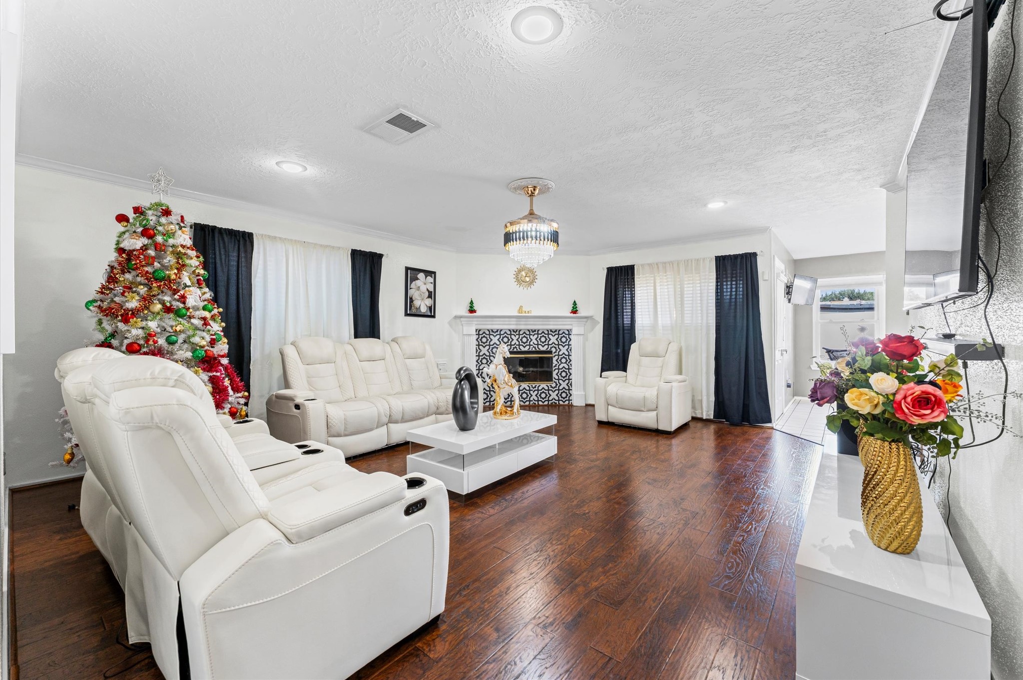 16506 Crossfield Drive Houston, TX 77095 - Photo 4 of 20 a living room with furniture fireplace and flat screen tv