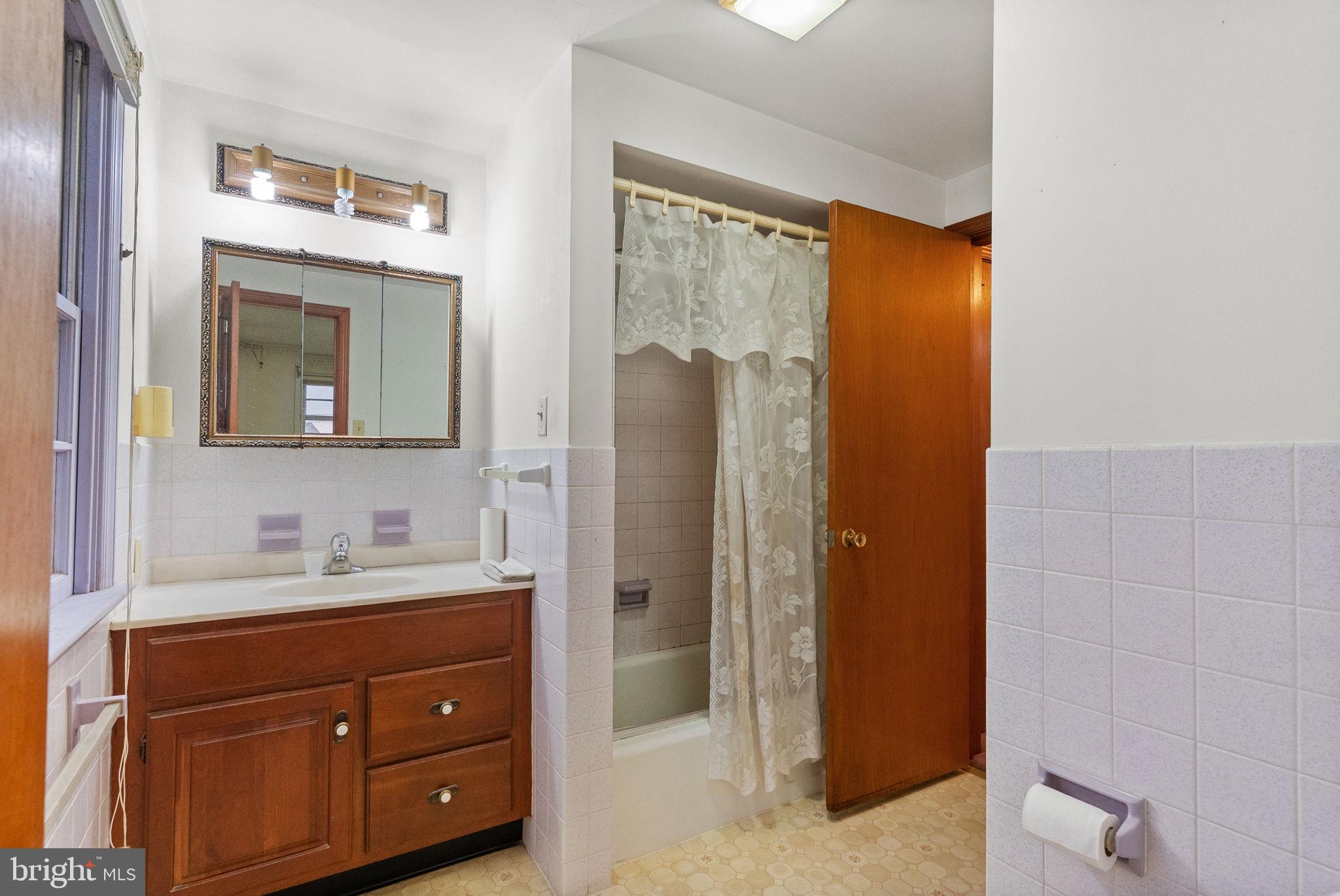 180 Delp Road Lancaster, PA 17601 - Photo 19 of 40 a bathroom with a double vanity sink and mirror