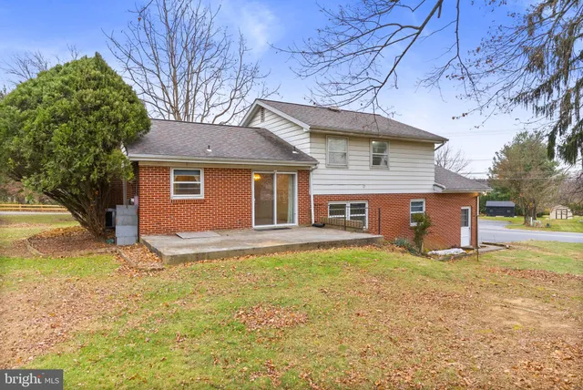 a house that has a tree in front of it