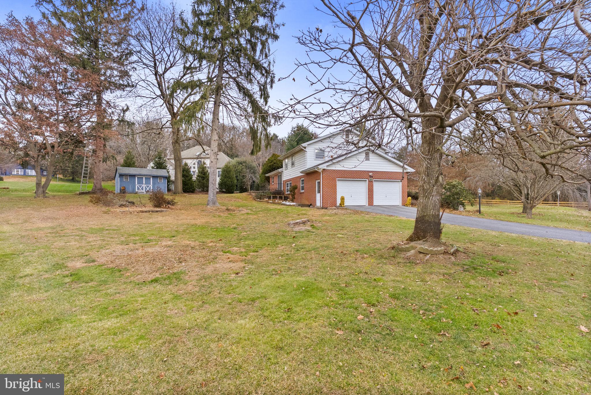 180 Delp Road Lancaster, PA 17601 - Photo 27 of 40 a yellow house with trees in front of it