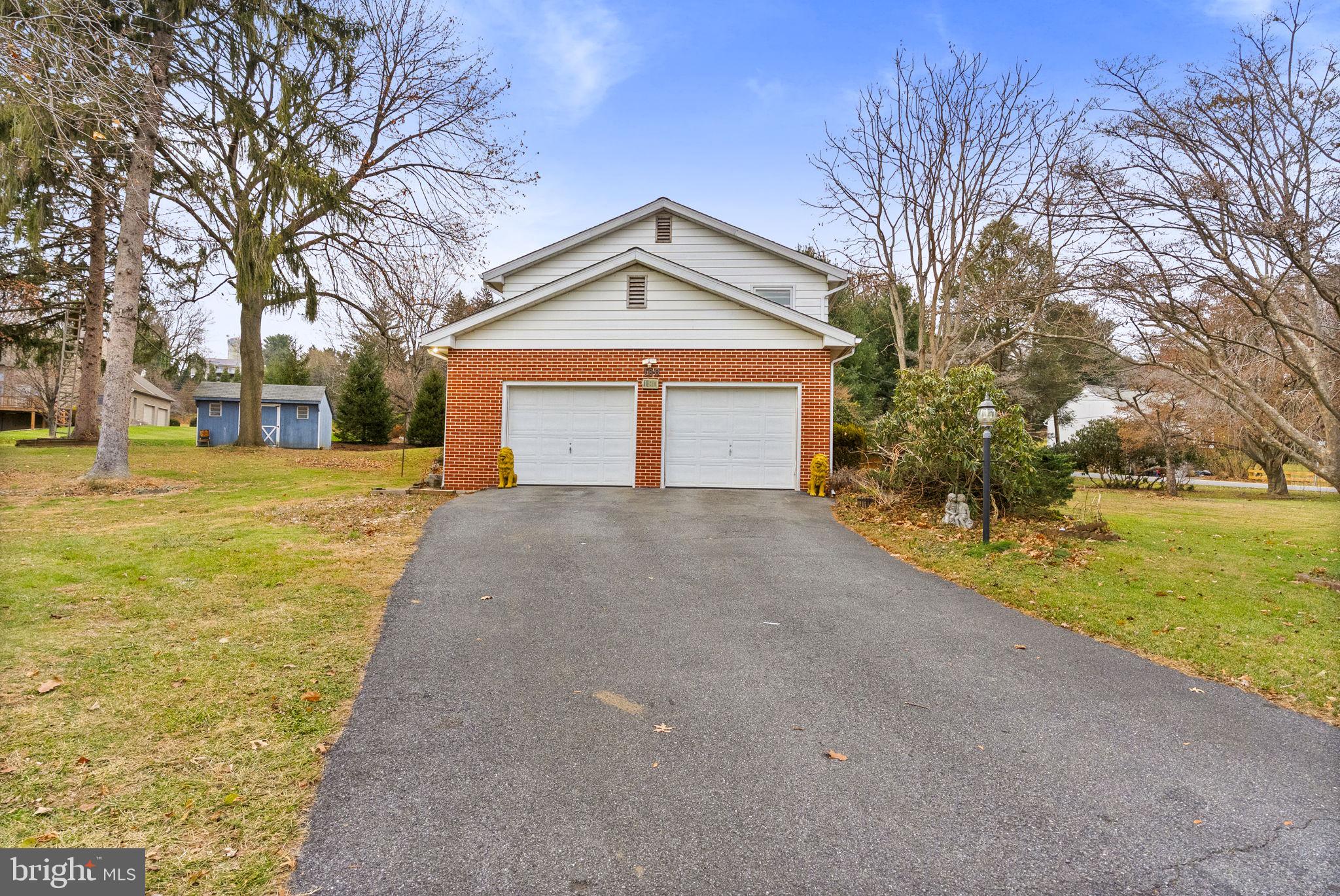 180 Delp Road Lancaster, PA 17601 - Photo 29 of 40 a front view of a house with a yard and garage