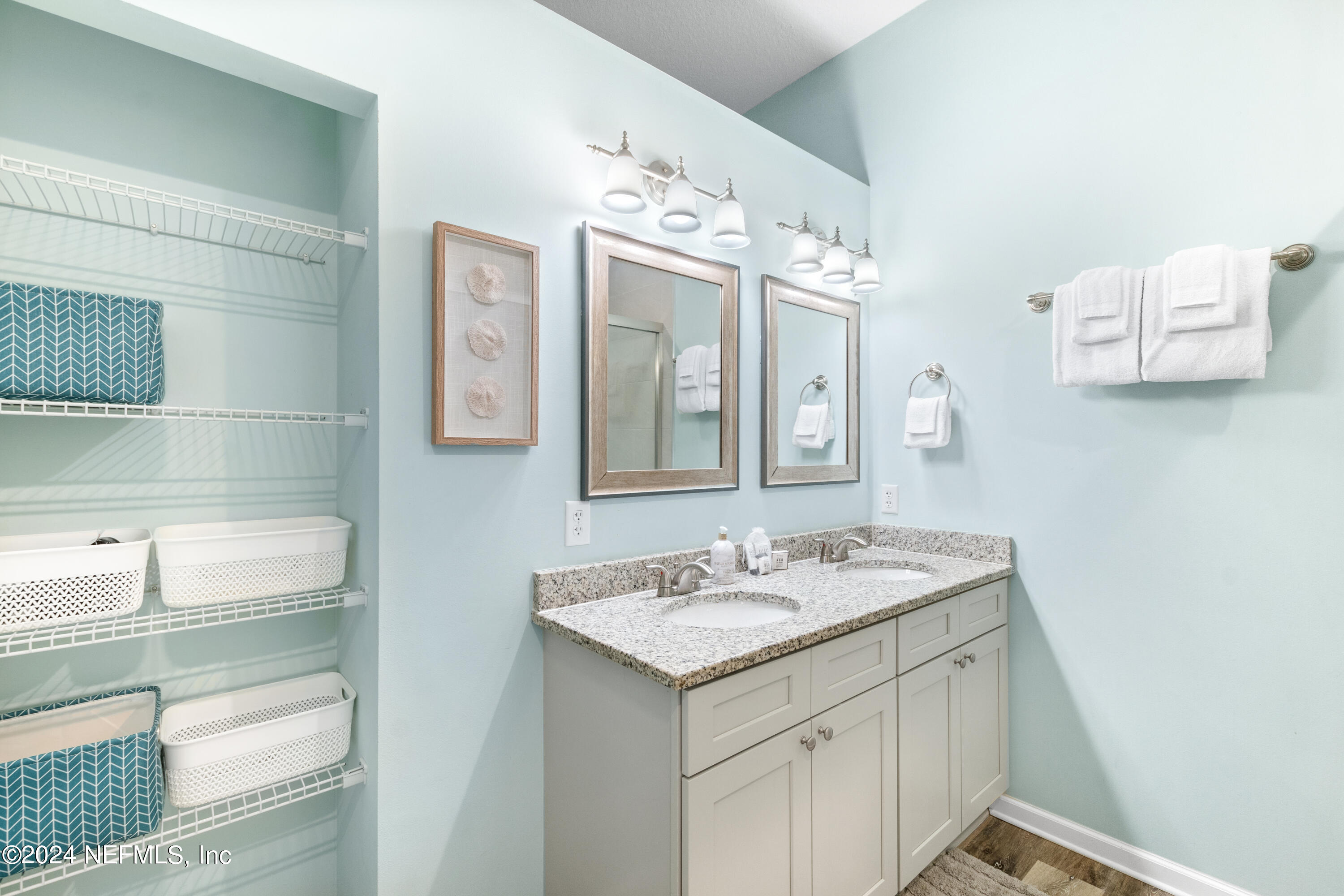 603 Boating Club Road St. Augustine, FL 32084 - Photo 22 of 32 a bathroom with a sink vanity and mirror