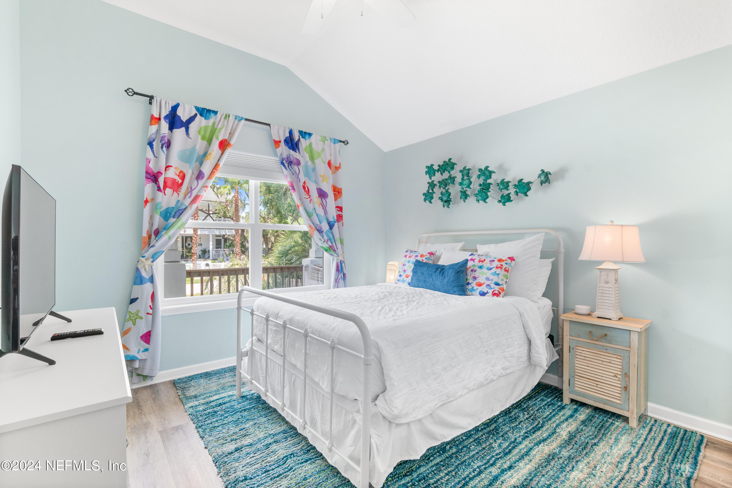 603 Boating Club Road St. Augustine, FL 32084 - Photo 23 of 32 a bedroom with a bed and a window