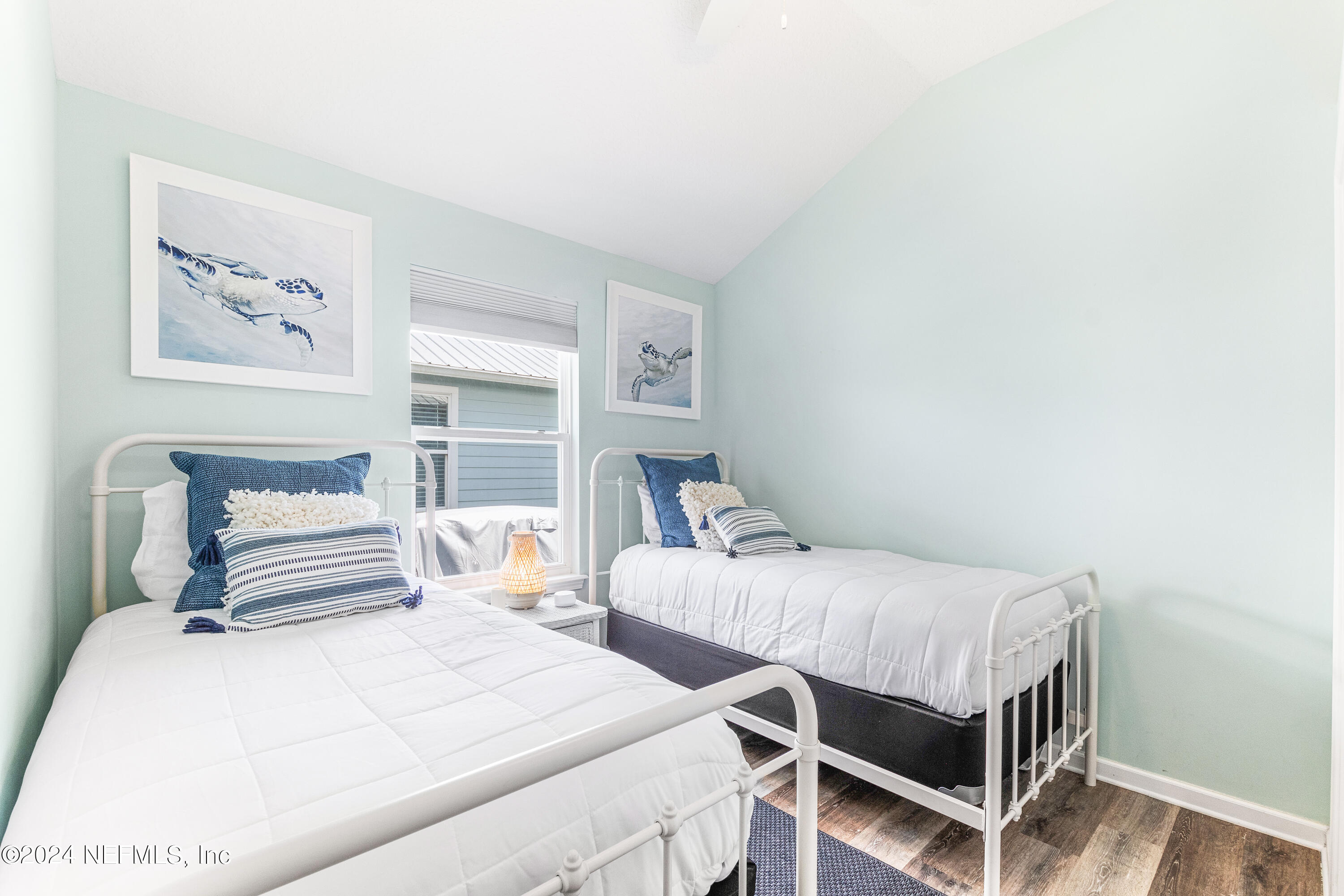 603 Boating Club Road St. Augustine, FL 32084 - Photo 28 of 32 a bedroom with two beds and a table