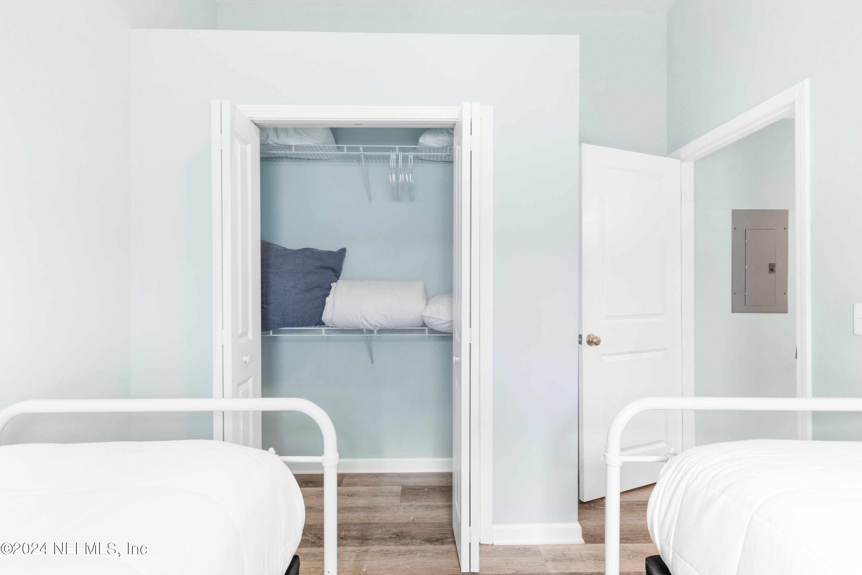603 Boating Club Road St. Augustine, FL 32084 - Photo 29 of 32 a bedroom with a bed and a chair