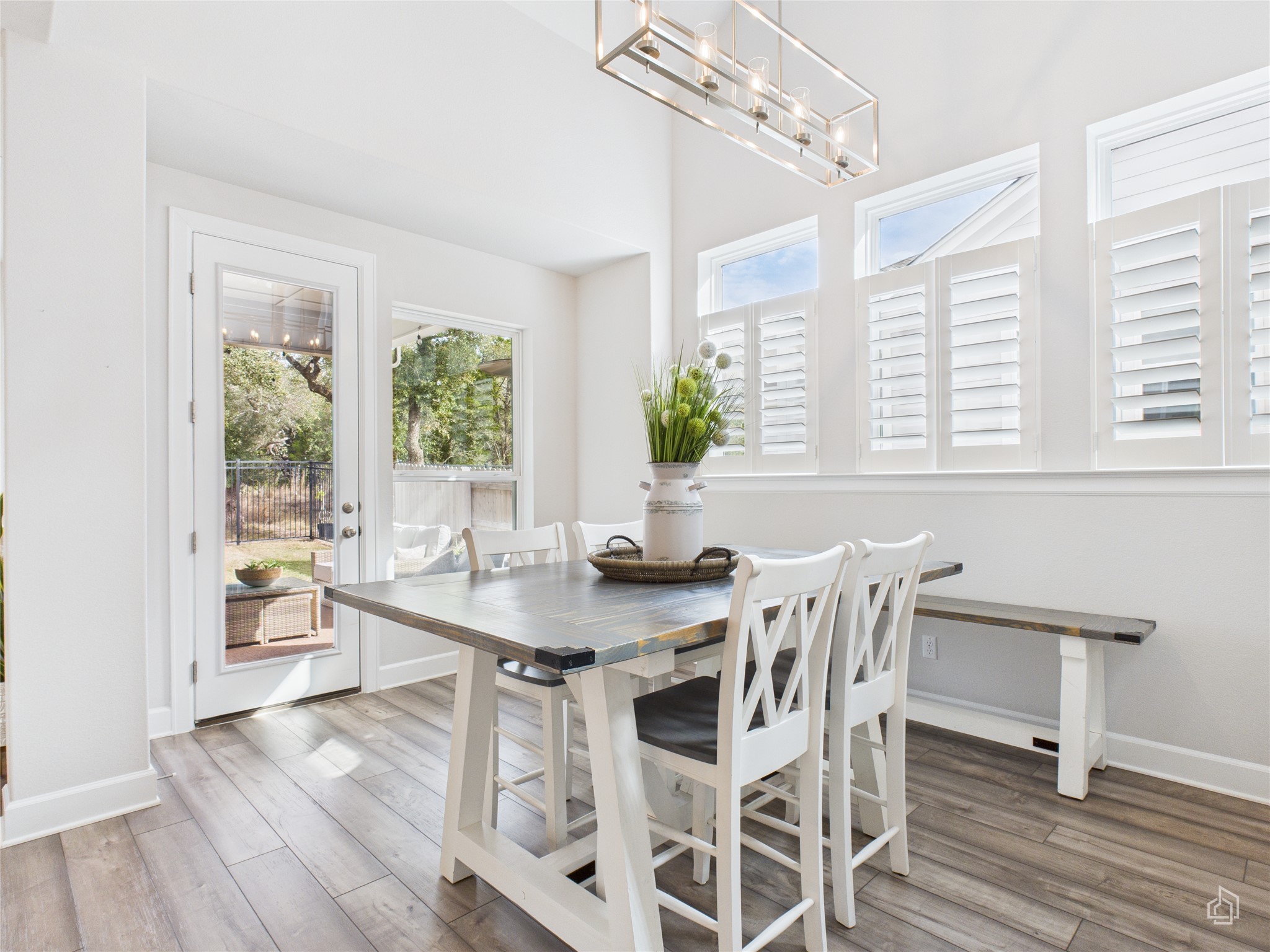 378 Moonlit Stream Pass Dripping Springs, TX 78620 - Photo 13 of 38 a view of a dining room with furniture a chandelier and wooden floor