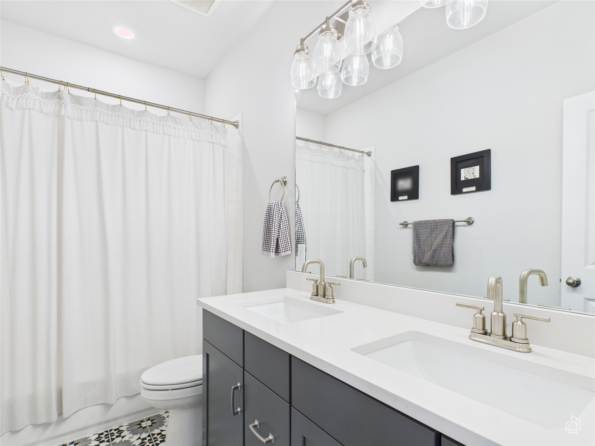 378 Moonlit Stream Pass Dripping Springs, TX 78620 - Photo 32 of 38 a bathroom with a sink a toilet and a large mirror