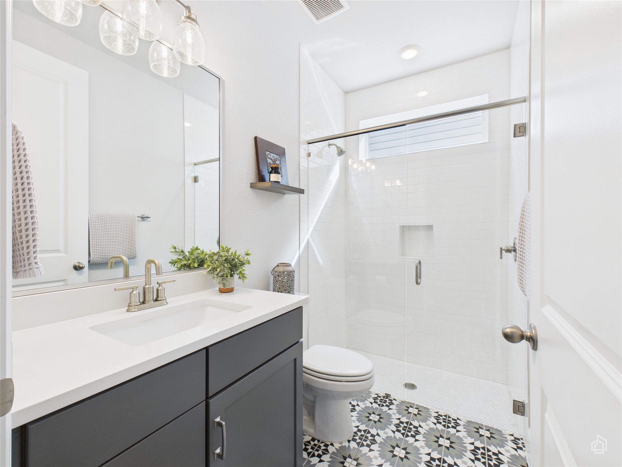 378 Moonlit Stream Pass Dripping Springs, TX 78620 - Photo 8 of 38 a bathroom with a sink a toilet and shower
