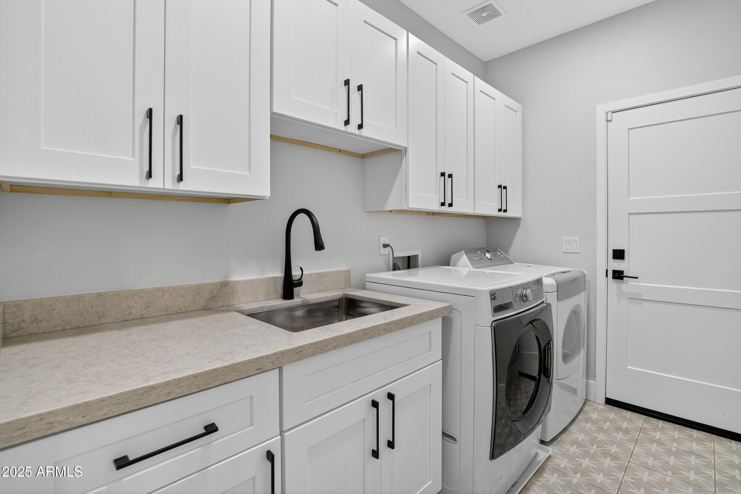 10587 East Sheena Drive Scottsdale, AZ 85255 - Photo 17 of 56 a view of a kitchen with sink and washing machine