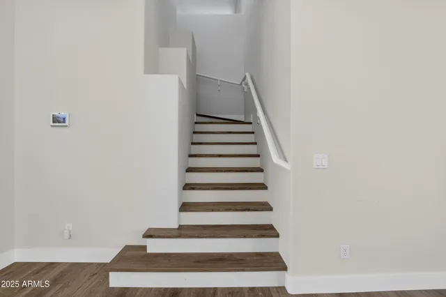 a view of a livingroom with hardwood floor and a window
