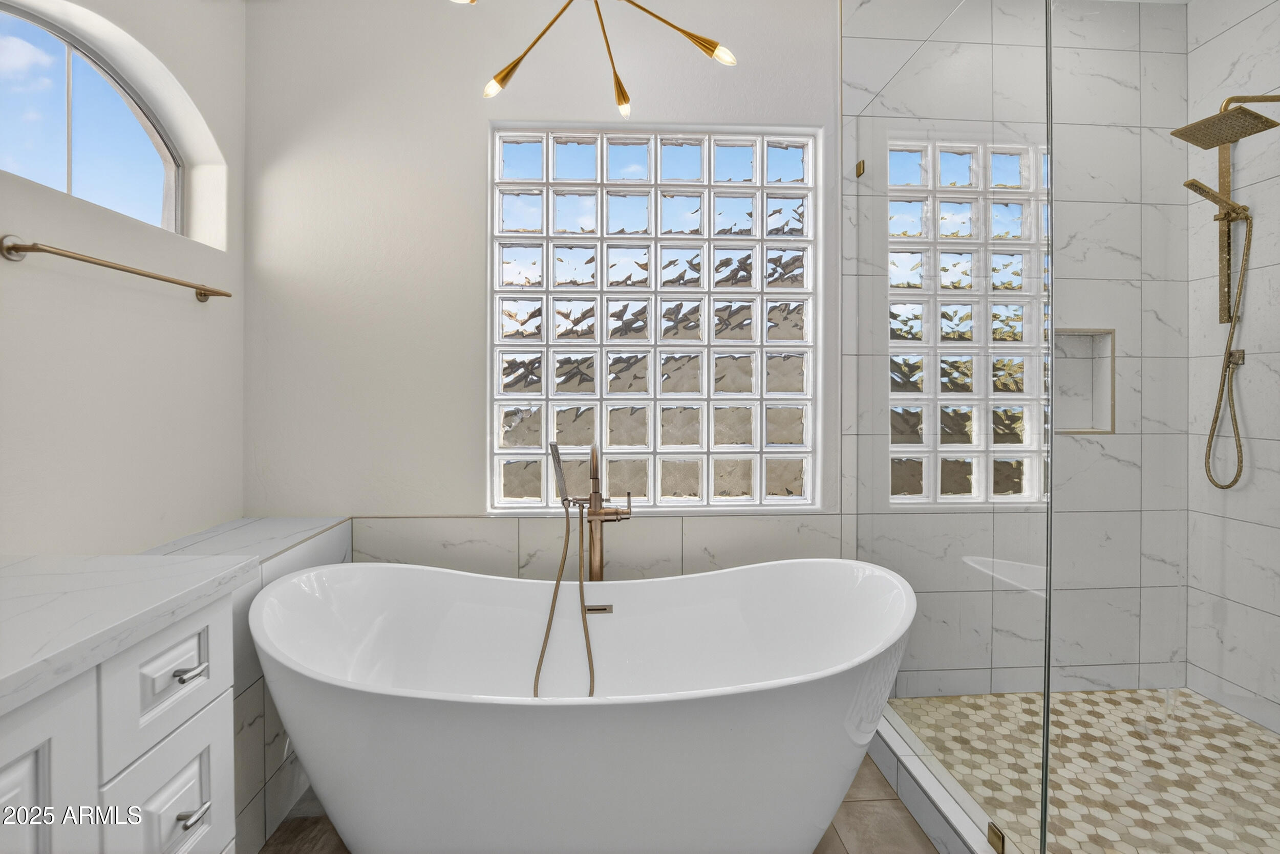 10587 East Sheena Drive Scottsdale, AZ 85255 - Photo 33 of 56 a white bath tub sitting next to a shower