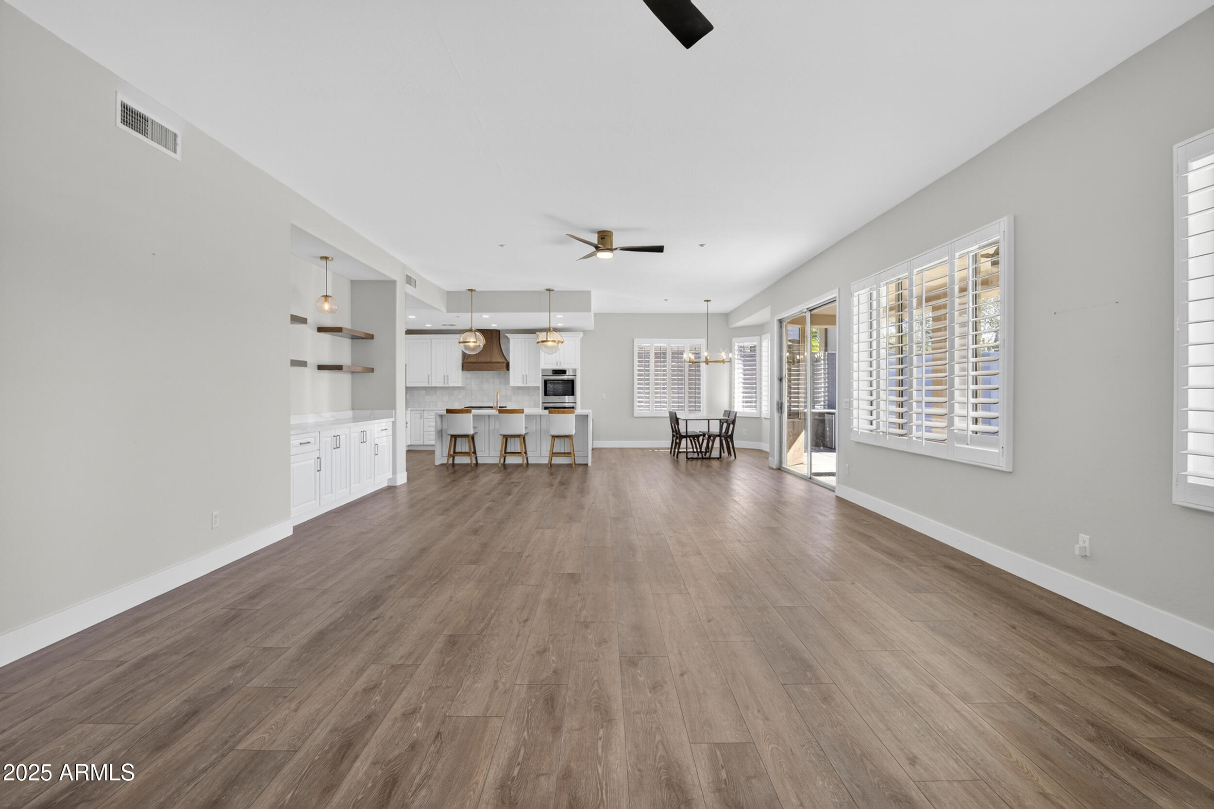 10587 East Sheena Drive Scottsdale, AZ 85255 - Photo 42 of 56 a view of a livingroom with hardwood floor and a window