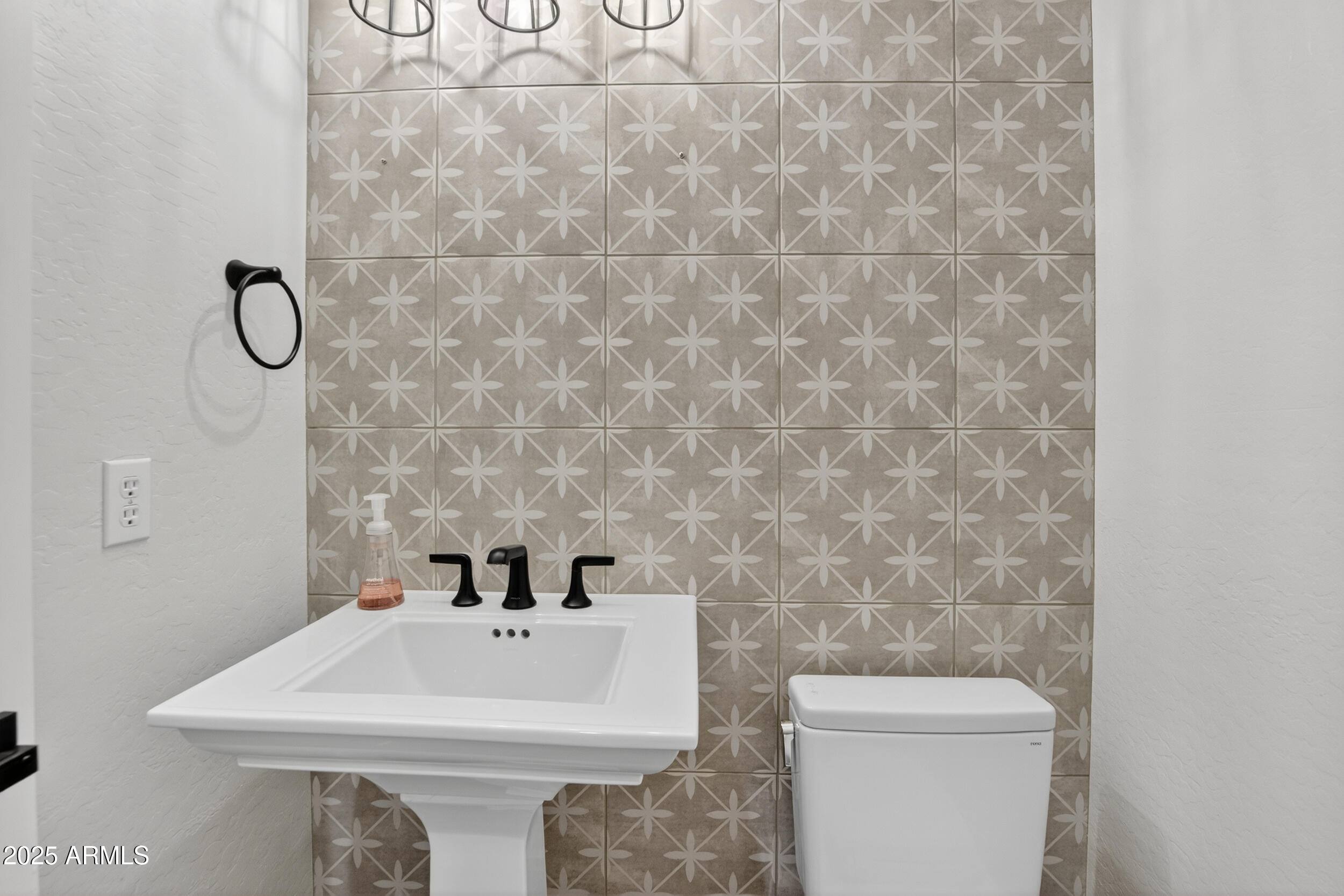 10587 East Sheena Drive Scottsdale, AZ 85255 - Photo 45 of 56 a bathroom with a sink a toilet and mirror