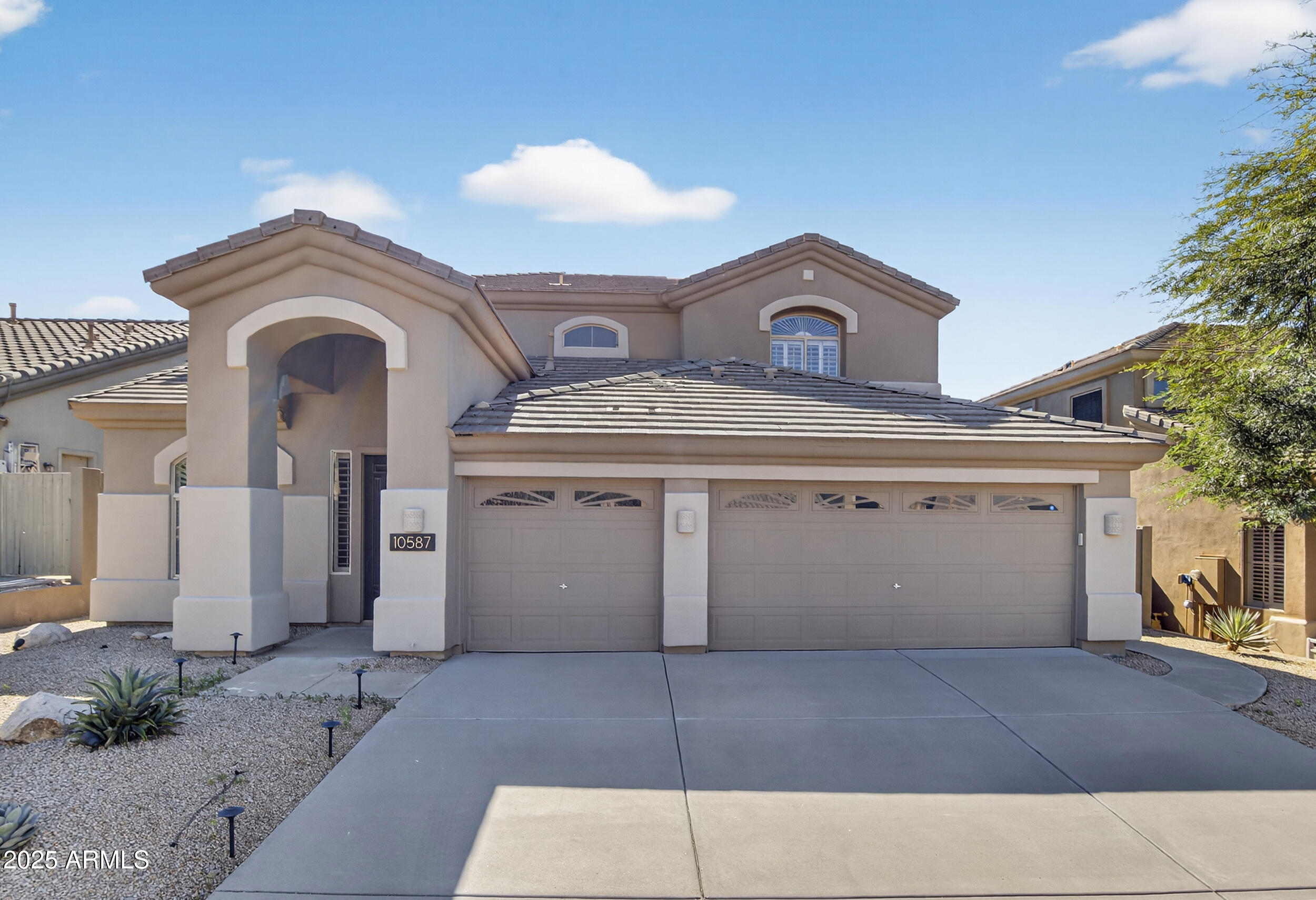 10587 East Sheena Drive Scottsdale, AZ 85255 - Photo 5 of 56 a view of a house with a outdoor space and a garage