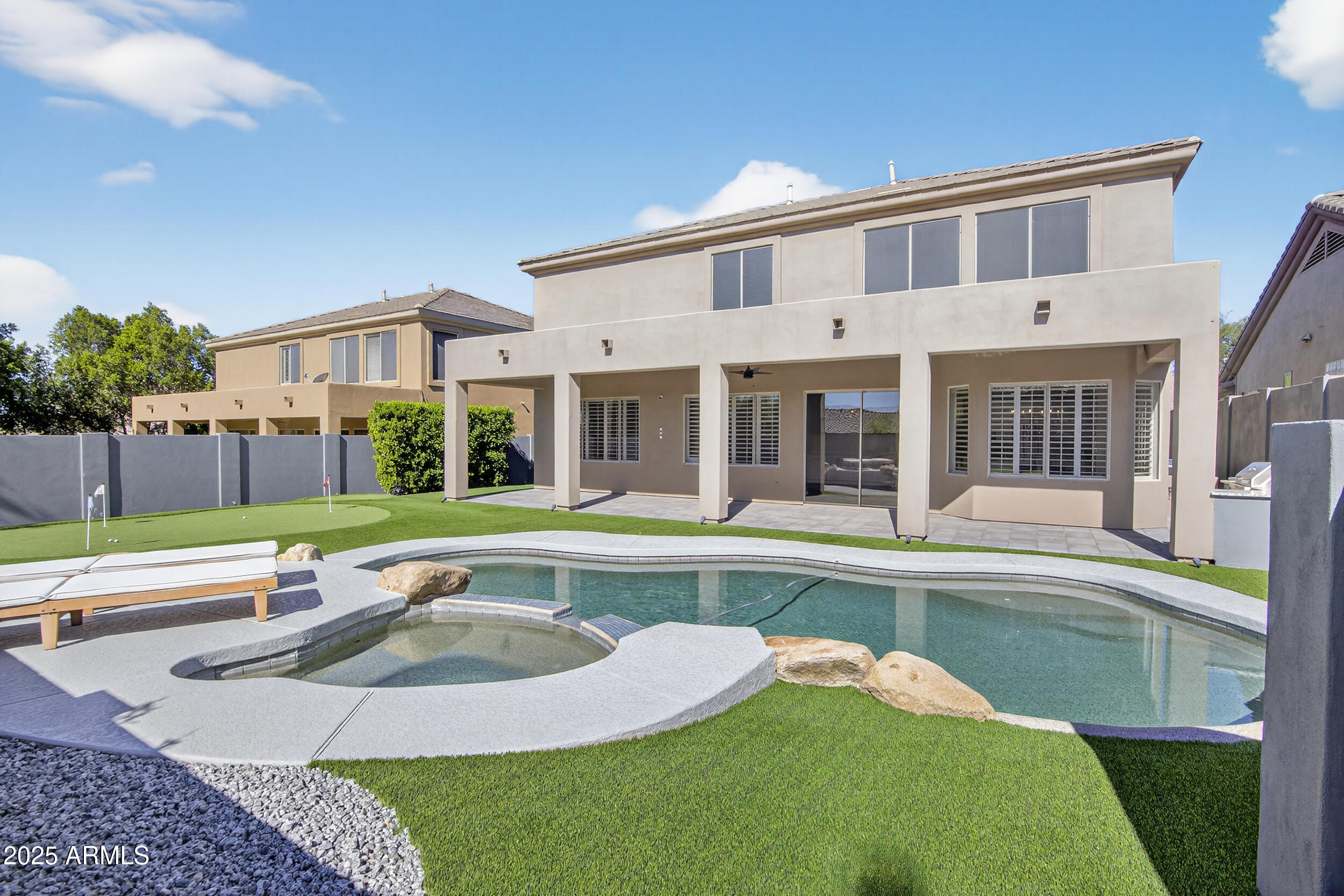 10587 East Sheena Drive Scottsdale, AZ 85255 - Photo 51 of 56 a front view of house with yard and outdoor seating