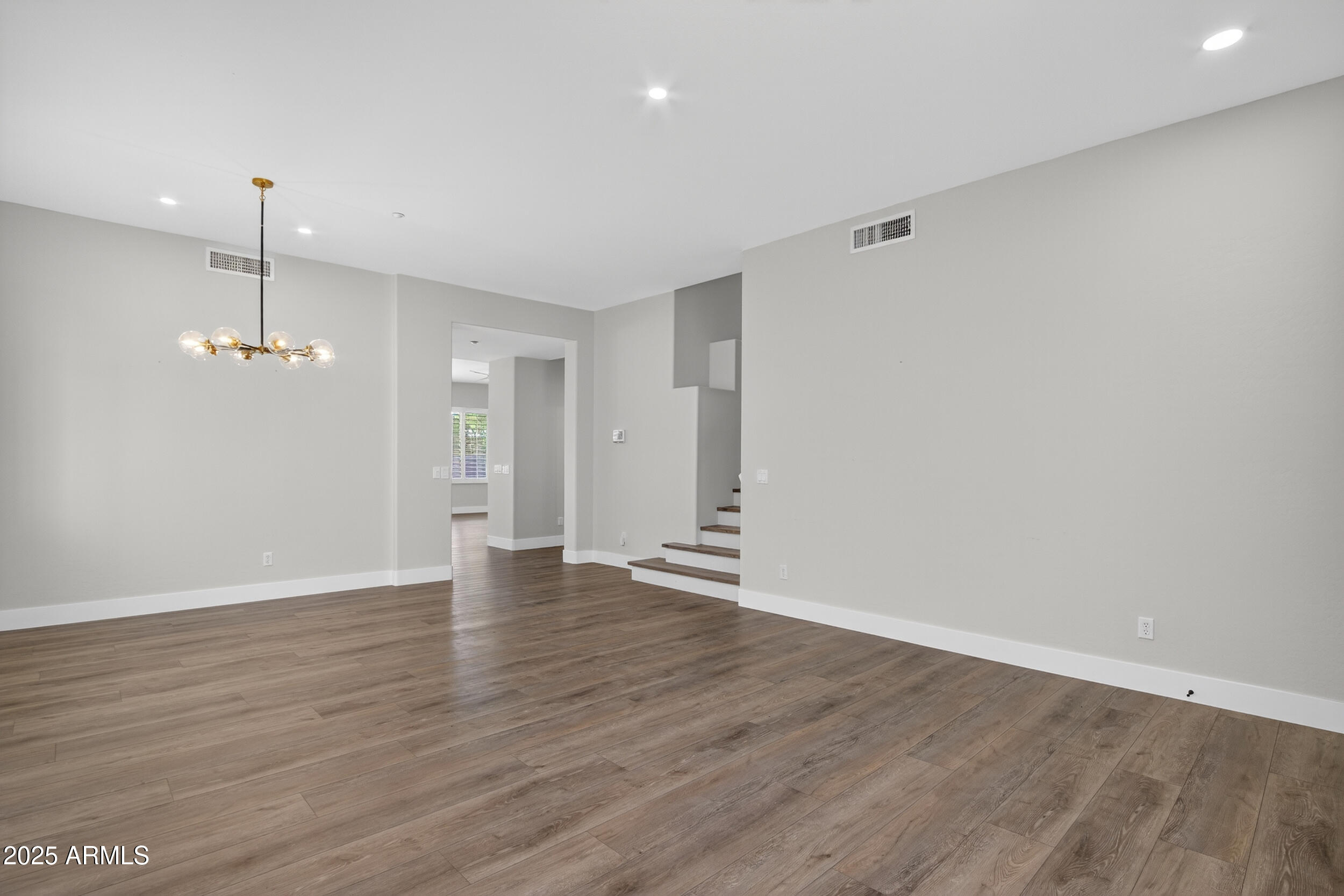 10587 East Sheena Drive Scottsdale, AZ 85255 - Photo 8 of 56 a view of empty room with wooden floor and ceiling fan