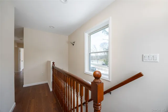 a view of a hallway with windows