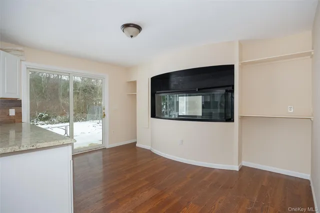 a view of a livingroom with wooden floor