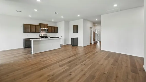 a view of kitchen with stainless steel appliances refrigerator stove microwave and oven