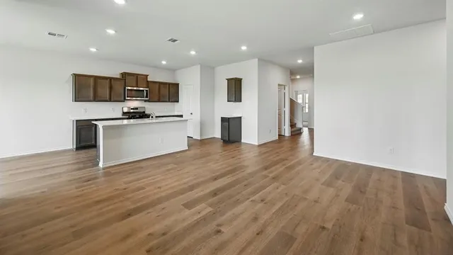 a view of kitchen with stainless steel appliances refrigerator stove microwave and oven