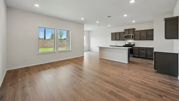 a view of kitchen with microwave and stove