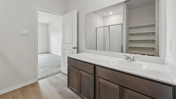 a bathroom with a sink and a mirror