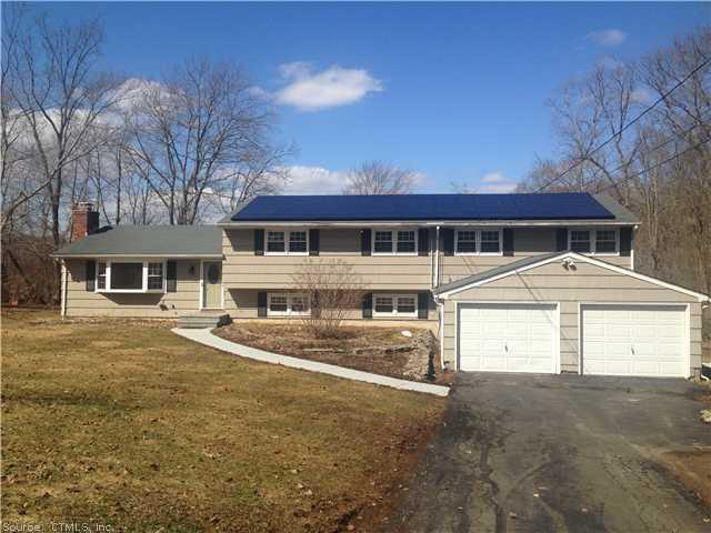 71 Woodside Road Guilford, CT 06437 - Photo 1 of 1 a front view of a house with a yard
