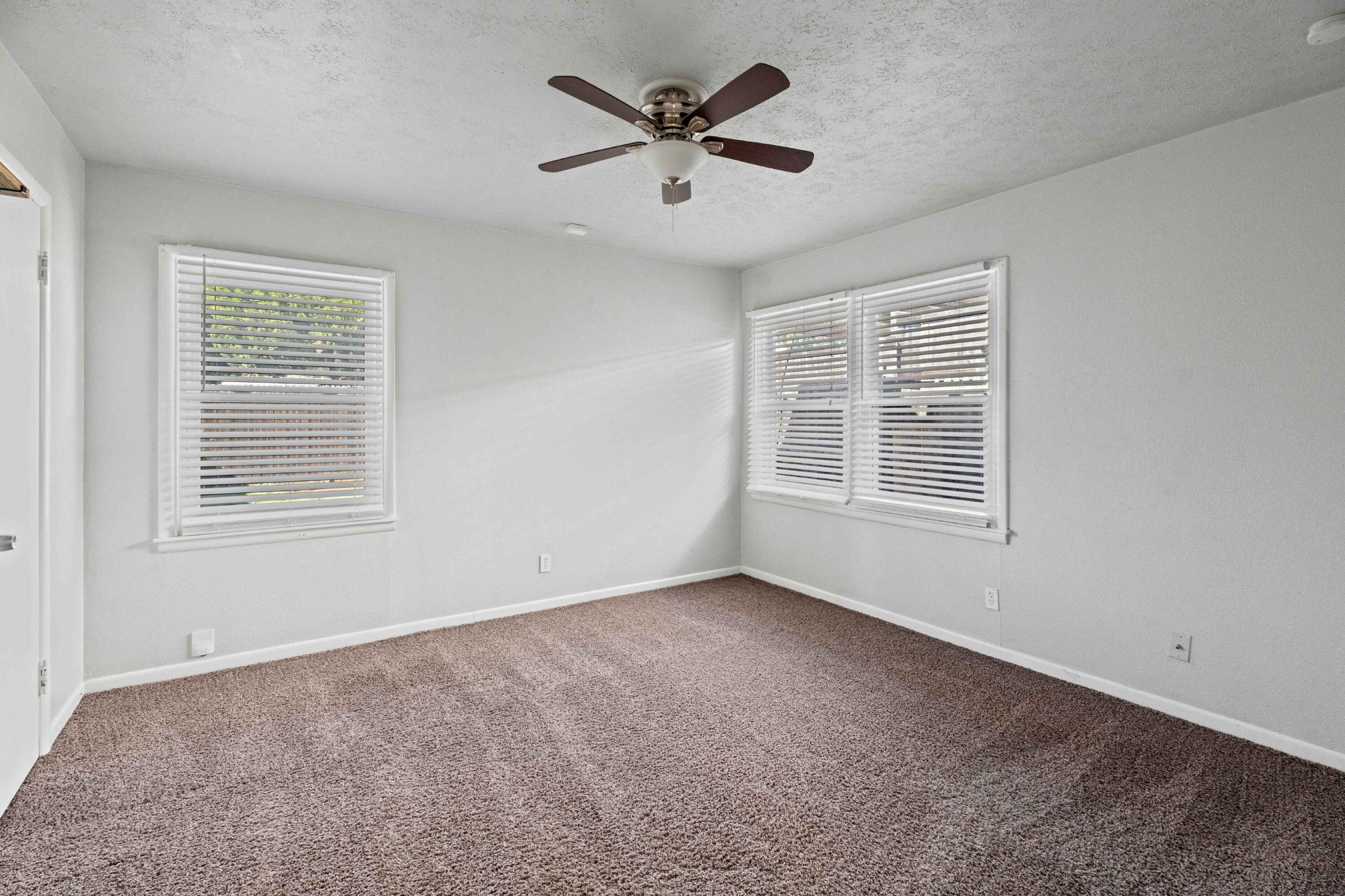 3520 42nd Street Lubbock, TX 79413 - Photo 11 of 12 a view of an empty room with a window