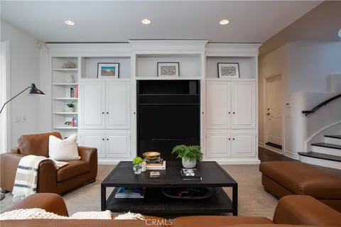 a kitchen with a cabinets and wooden floor