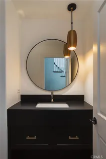 a living room with furniture a flat screen tv and a window