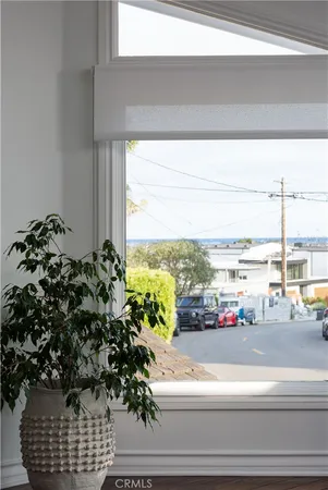 a picture of a floor to ceiling window and an ocean view