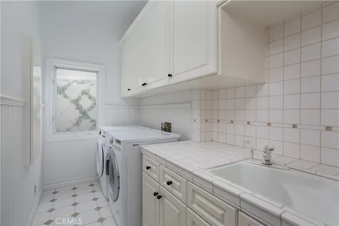 a view of a balcony with floor to ceiling window and wooden fence