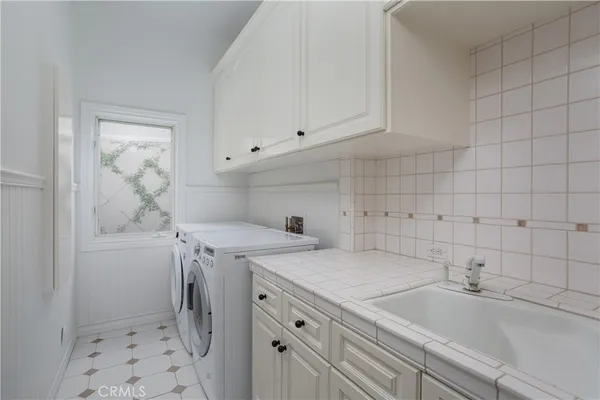 a view of a balcony with floor to ceiling window and wooden fence