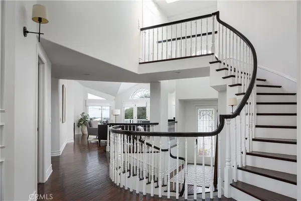 a view of entryway with wooden floor and windows