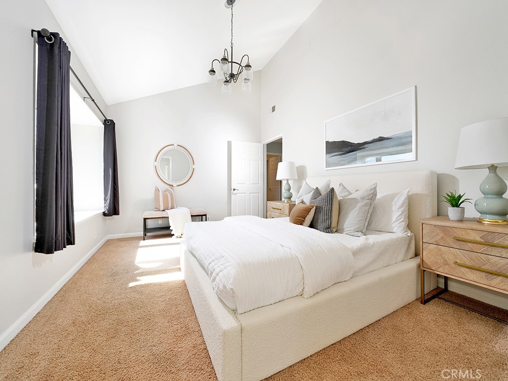 25102 Danabirch Dana Point, CA 92629 - Photo 13 of 53 a bedroom with bed and a night stand