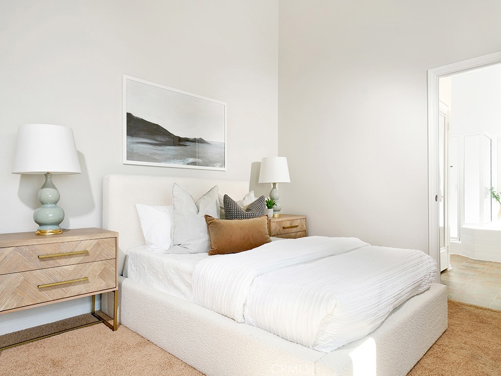 25102 Danabirch Dana Point, CA 92629 - Photo 14 of 53 a bedroom with a bed and a night stand